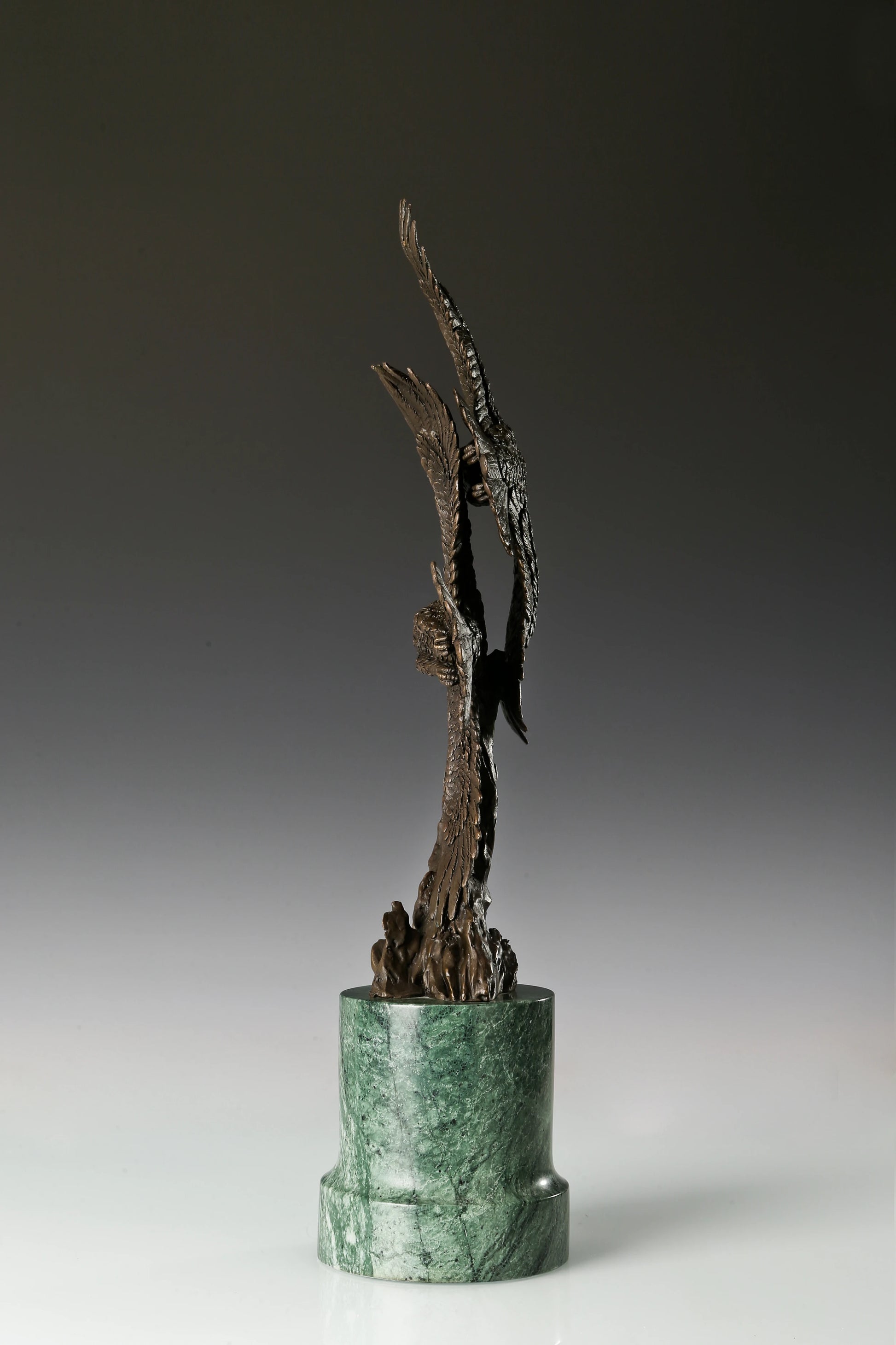 Two eagles soaring bronze sculpture with detailed feathers and marble base. Elegant wildlife statue for home decor, office, or collectors.