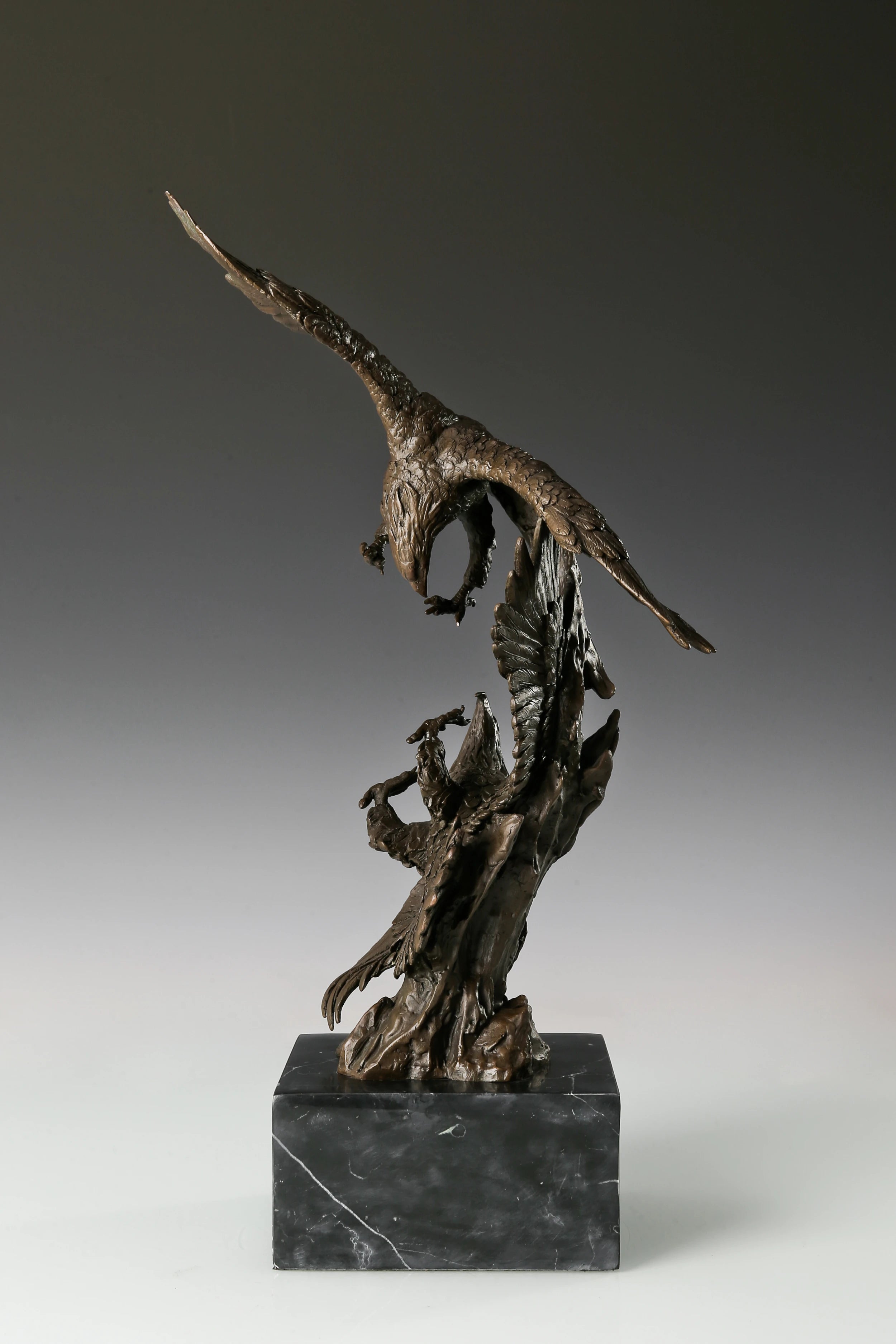 Solid bronze eagles sculpture on black marble base, powerful office decor for law firms and executives.
