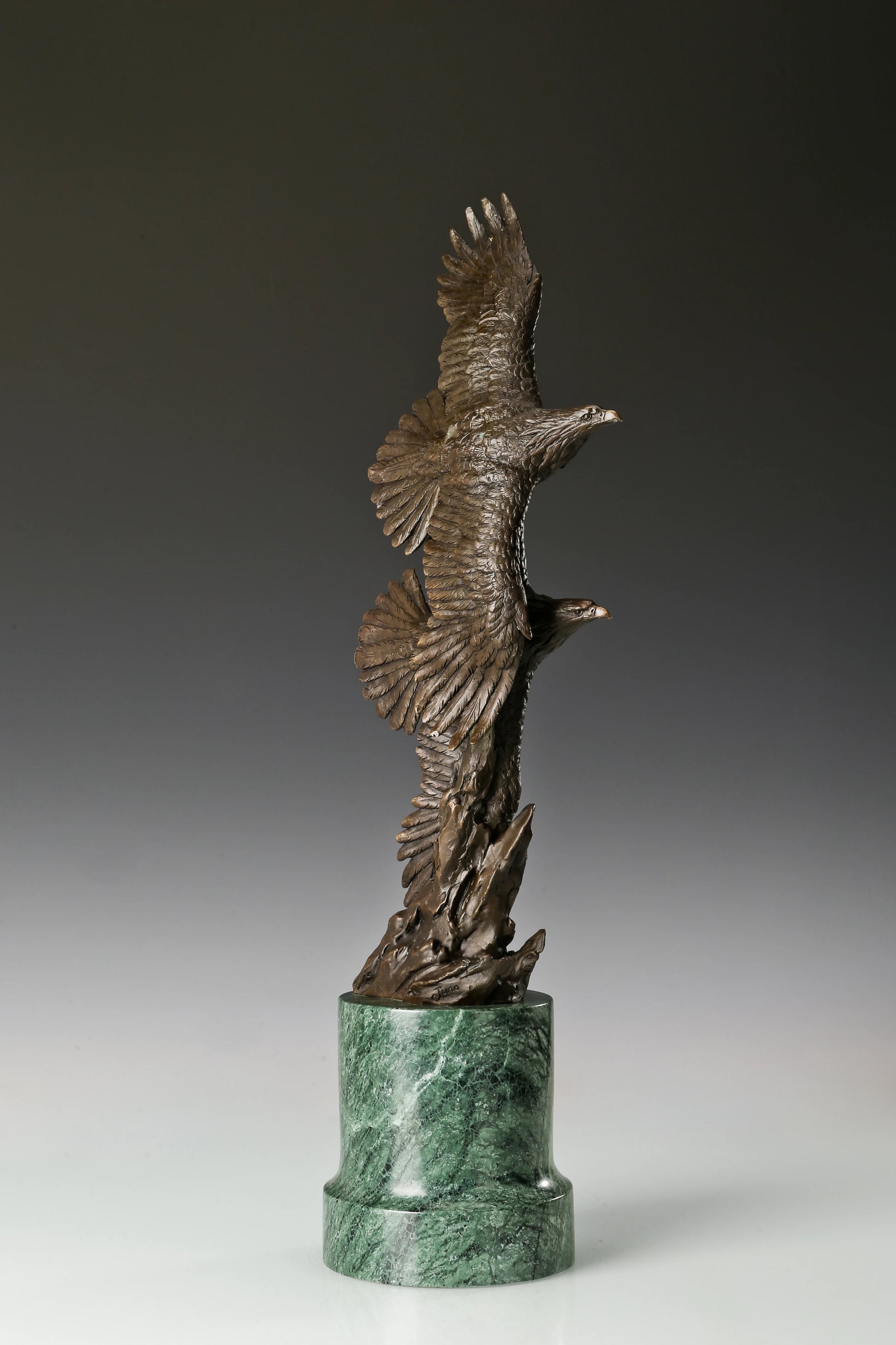 Solid bronze twin eagles soaring statue on green marble base, luxury office desk decor for executives.
