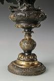 Elegant bronze eagle sculpture with ornate pedestal and detailed feathers. A refined statement piece symbolizing strength, control, and authority.