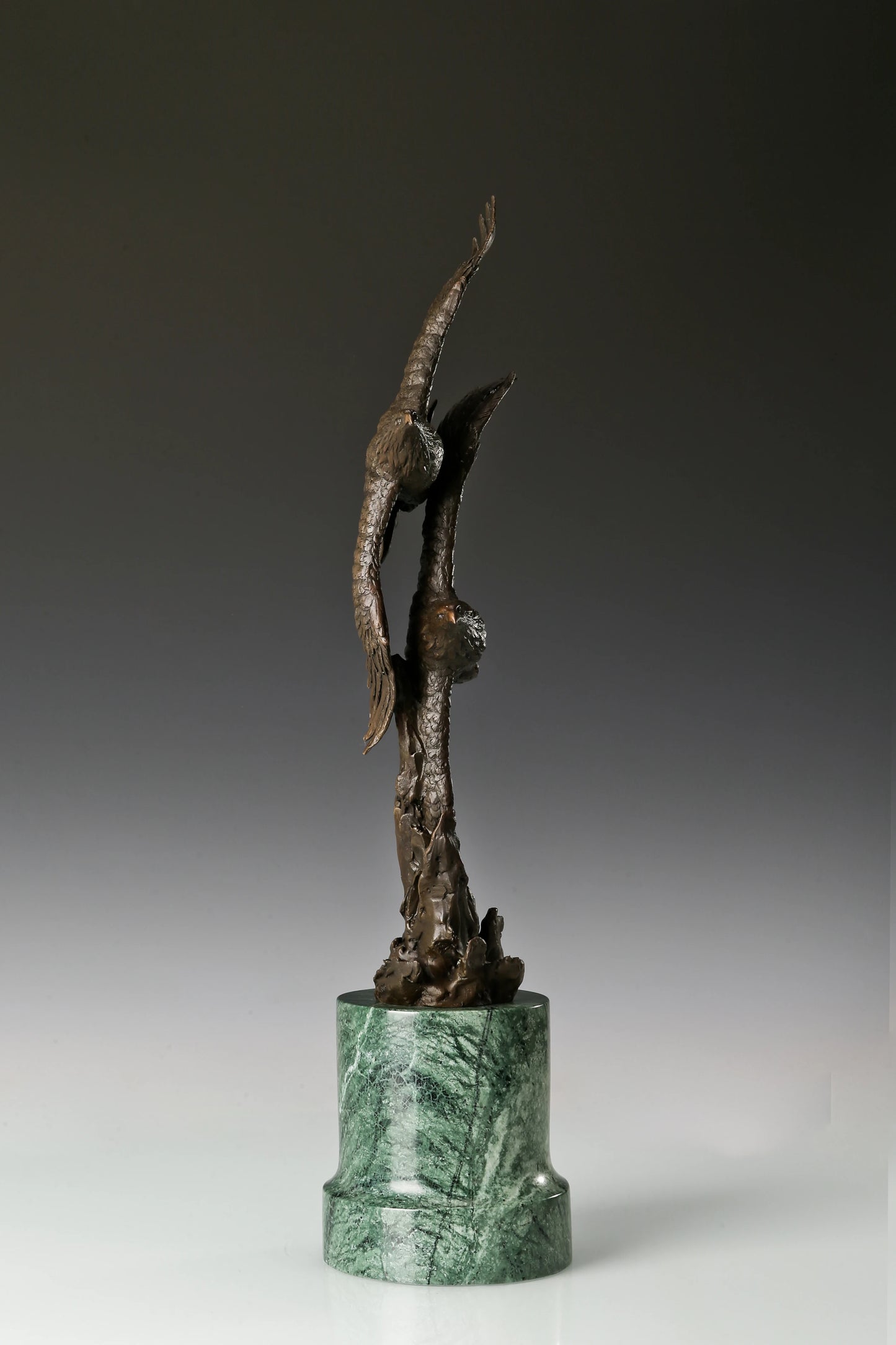 Solid bronze twin eagles soaring statue on green marble base, luxury office desk decor for executives.