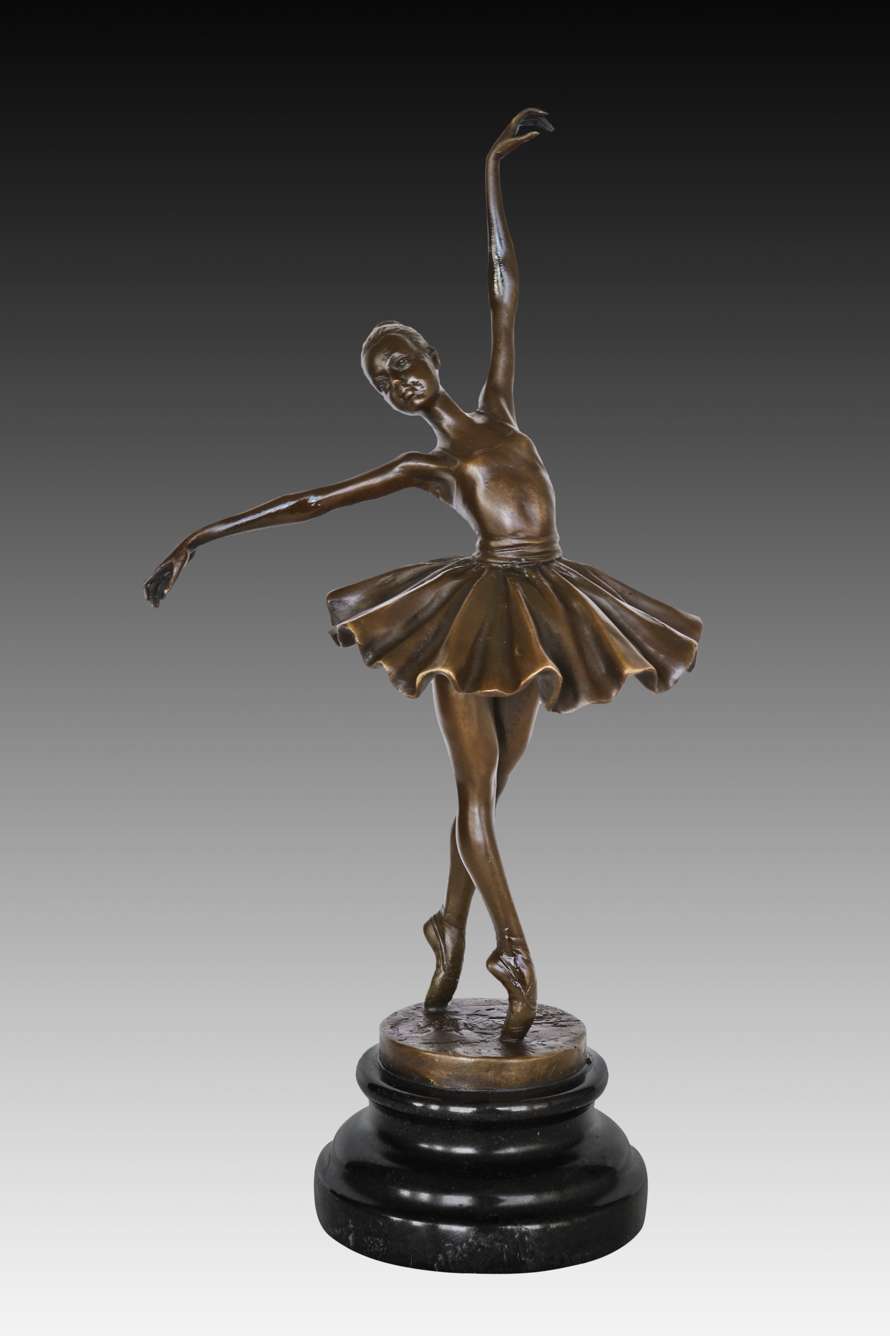 classical ballet dancer bronze statue showing the graceful posture and flowing tutu