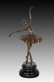 classical ballet dancer bronze statue showing the graceful posture and flowing tutu