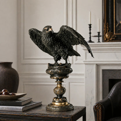 Elegant bronze eagle sculpture with ornate pedestal and detailed feathers. A refined statement piece symbolizing strength, control, and authority.