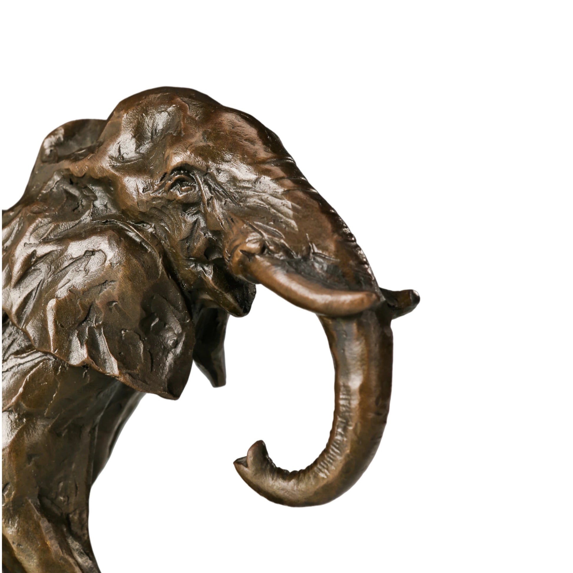 Dynamic bronze elephant sculpture featuring expressive texture and raised trunk. A striking wildlife statue symbolizing strength, resilience, and prosperity.