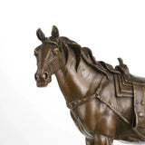 Close-up of saddle and bridle craftsmanship in bronze