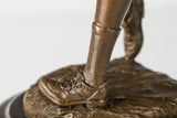 Upper-body detail of female golfer bronze sculpture holding a raised golf club