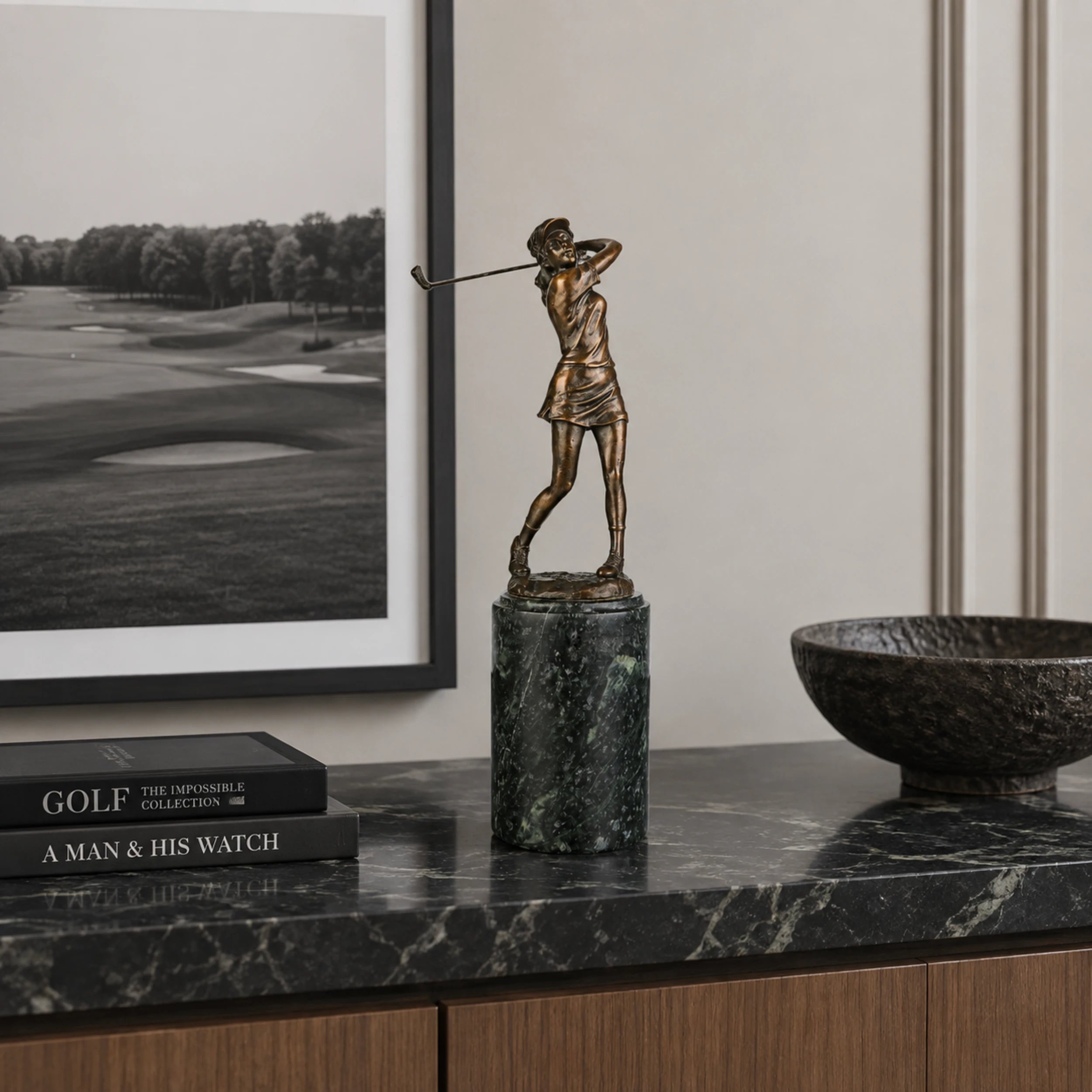 Female Golfer Swing Bronze Sculpture displayed in a modern interior
