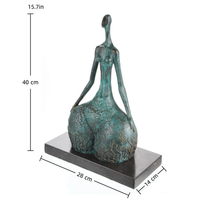 Contemporary abstract bronze female sculpture with green verdigris patina and golden branch motifs, faceless nature-inspired woman statue on black marble base, loss wax casting fine art.