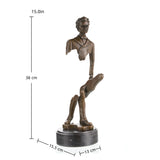 Surrealist bronze violinist sculpture with floating fragmented body
