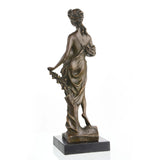 this classical female sculpture features flowing drapery and a black marble base. A perfect 8th-anniversary gift or mythology art for luxury home decor.