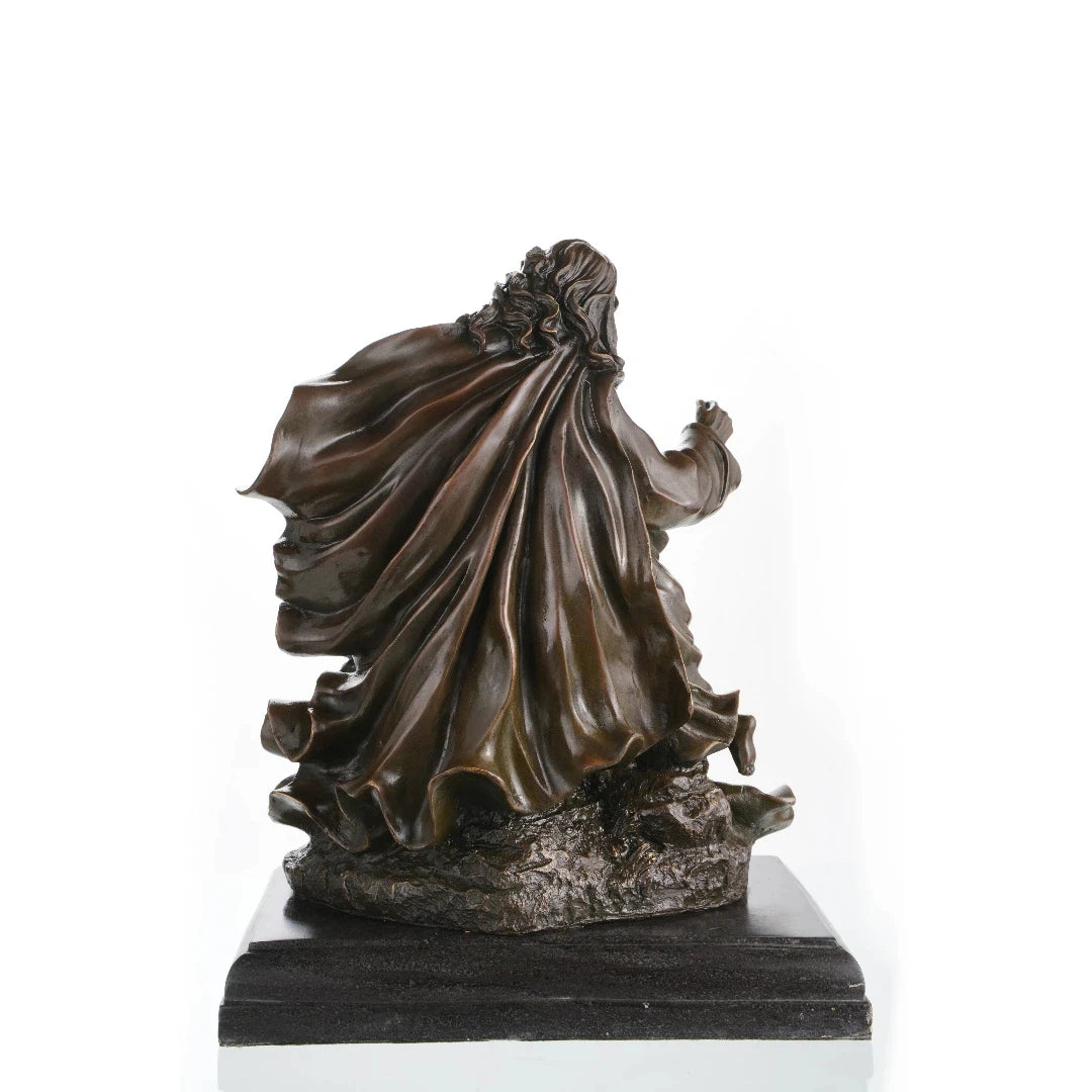 Flowing robes detail in religious bronze sculpture