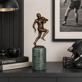 Football Player Bronze Sculpture displayed in a modern interior