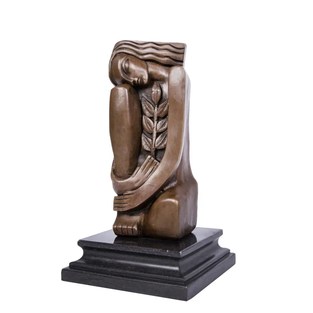 Modernist bronze female sculpture with olive branch on black marble base, minimalist peace statue for modern home decor.