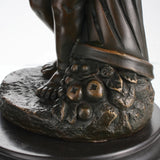 Grapes and fruit carving detail in bronze statue