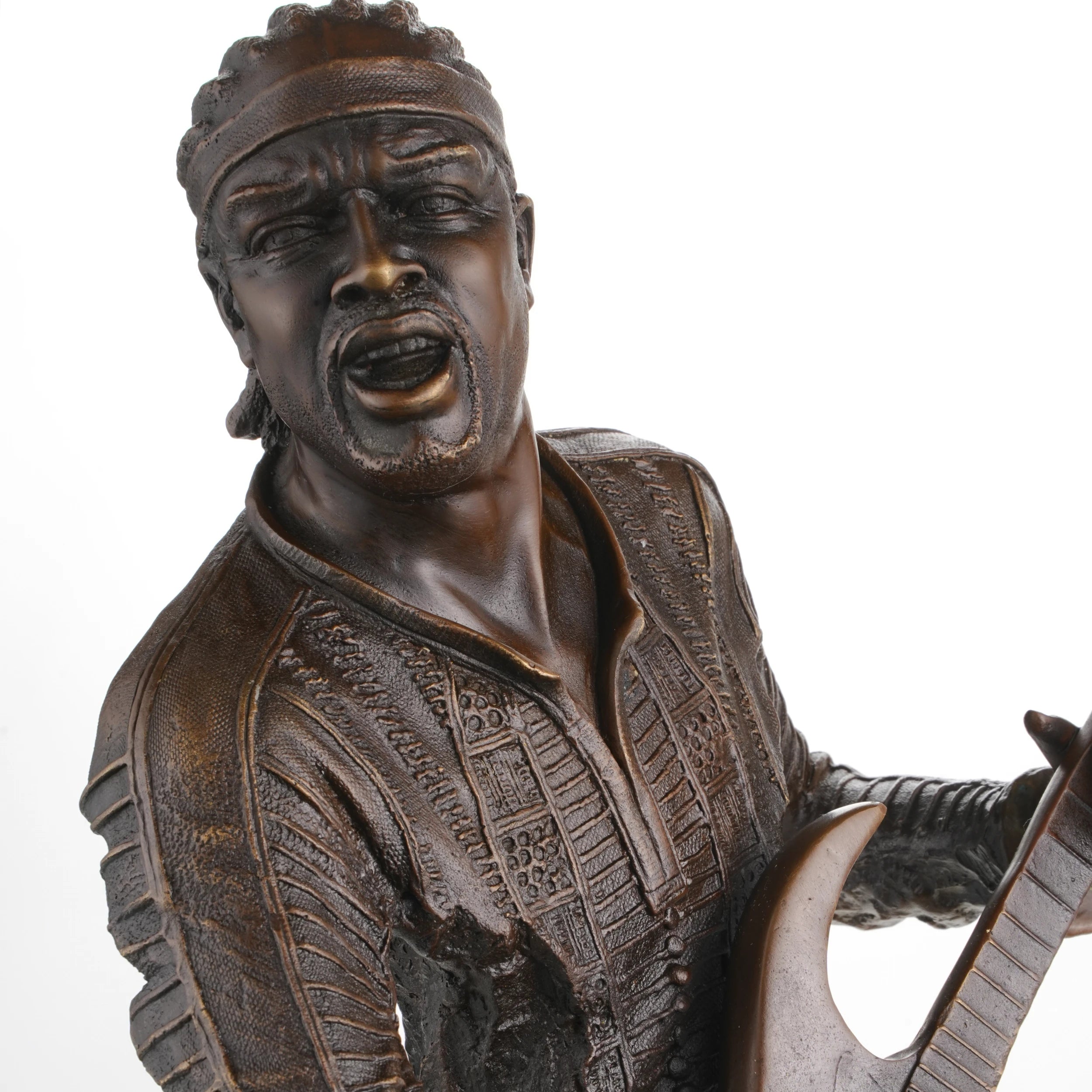 Close-up of guitarist facial expression in bronze sculpture