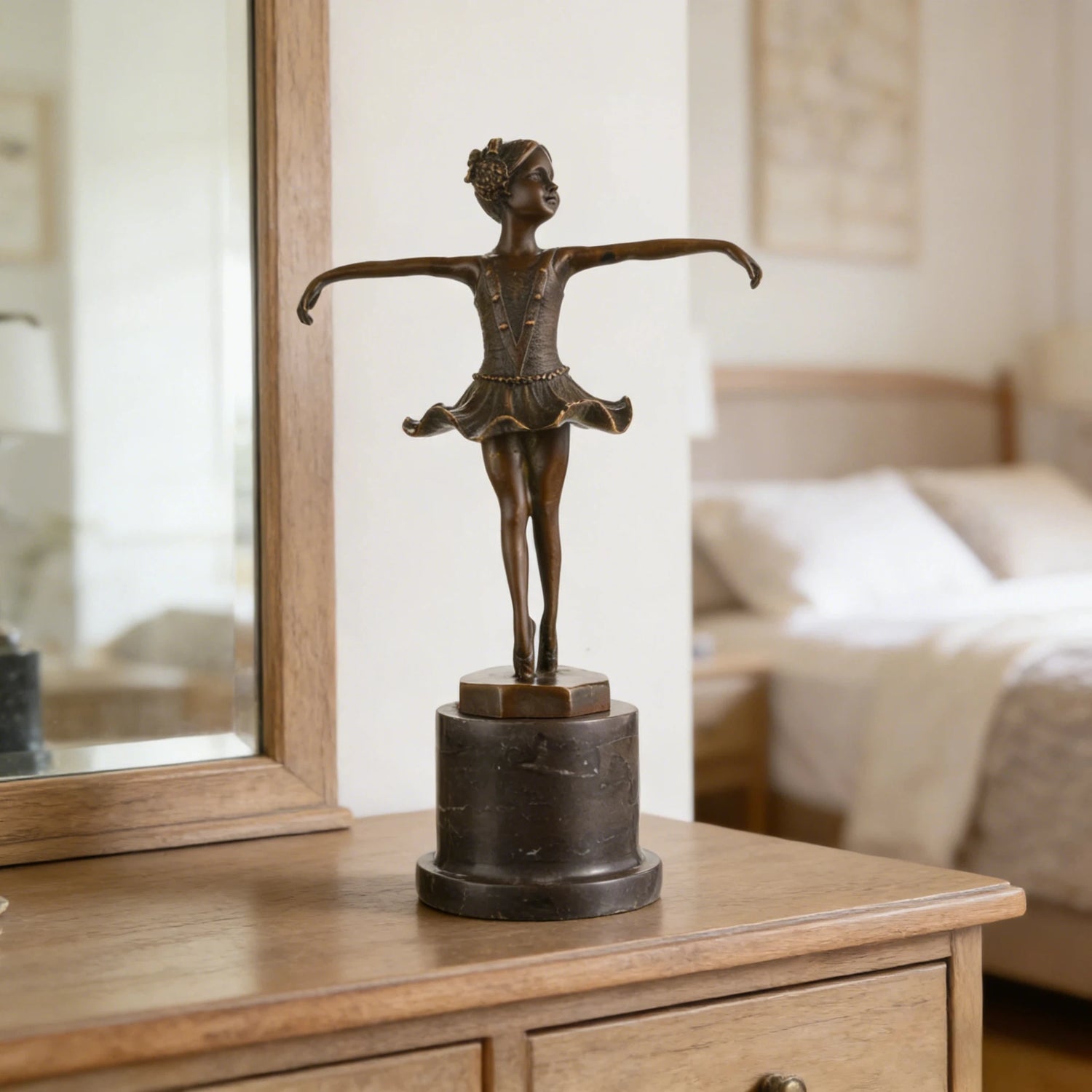Bronze ballerina sculpture in a graceful ballet pose with marble base. A delicate dancer statue symbolizing elegance, innocence, and artistic beauty.