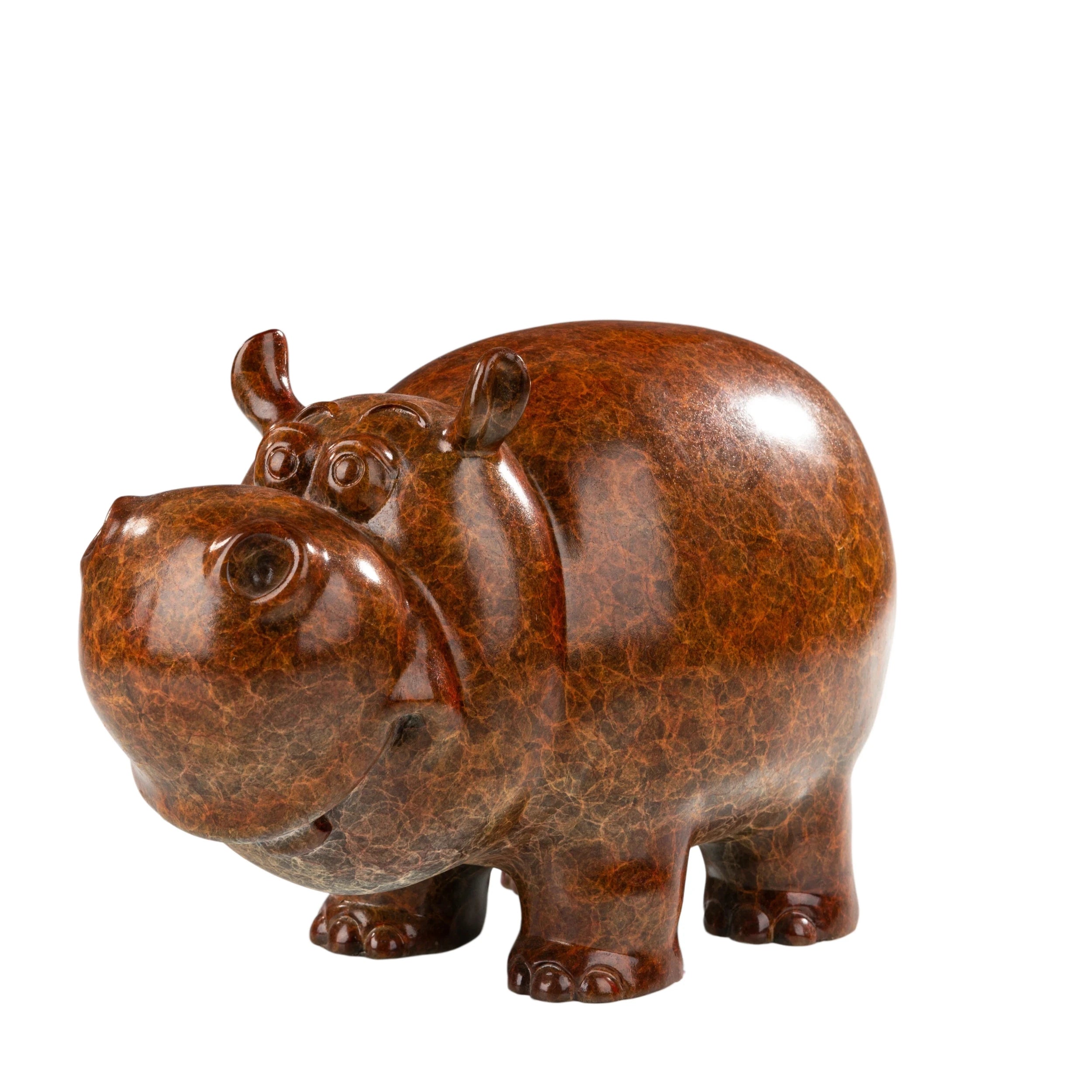 Front left view of cute bronze cow statue