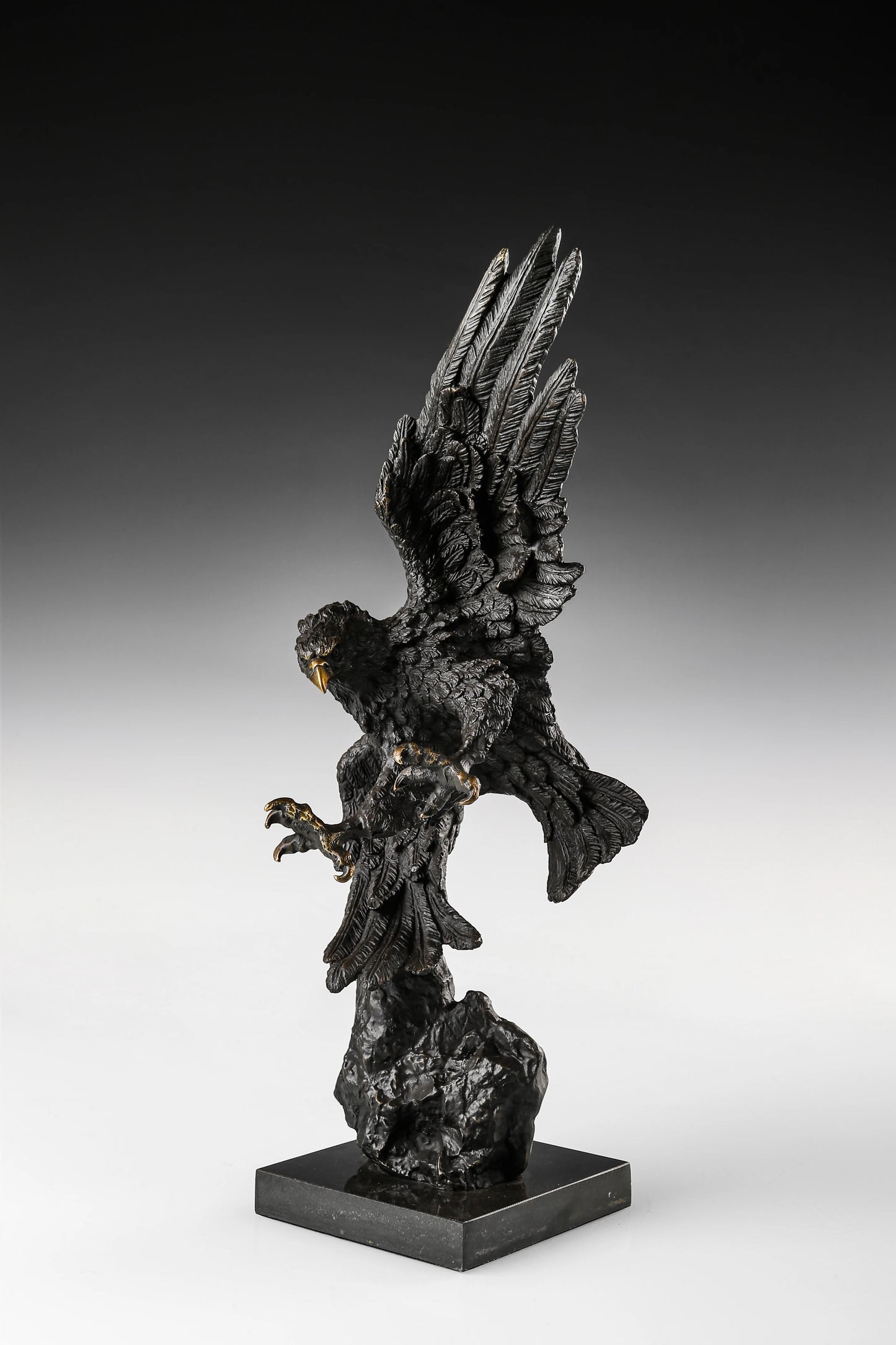 Dynamic bald eagle bronze sculpture in a powerful diving pose with marble base. A striking wildlife statue symbolizing strength, freedom, and leadership.