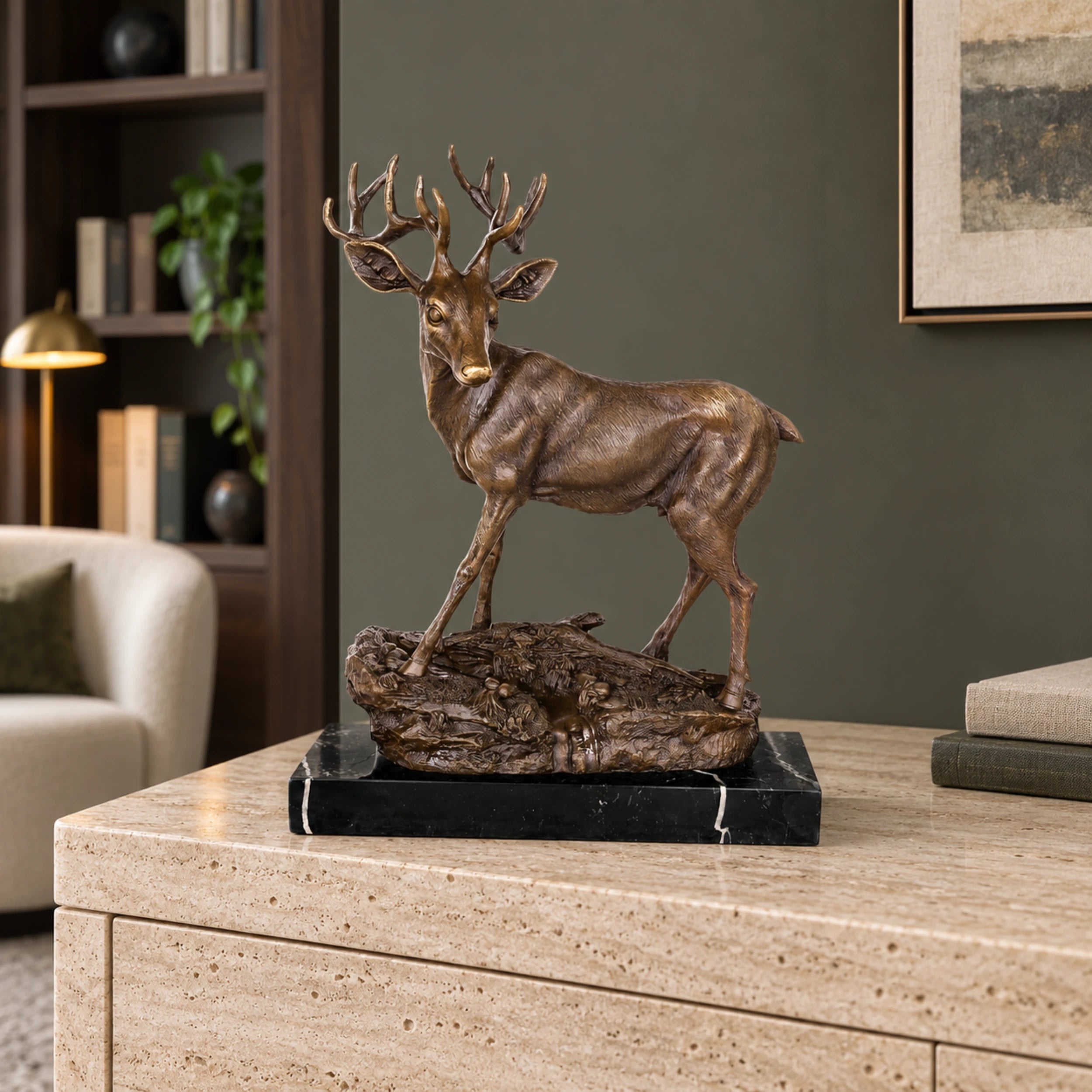Handcrafted bronze stag sculpture featuring detailed antlers and naturalistic base. Lost-wax cast deer statue on marble base, ideal for luxury home decor.