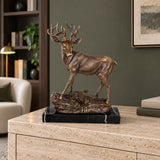 Handcrafted bronze stag sculpture featuring detailed antlers and naturalistic base. Lost-wax cast deer statue on marble base, ideal for luxury home decor.