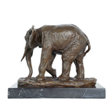 Realistic African elephant bronze sculpture with detailed texture and rich patina. A timeless wildlife statue symbolizing strength, wisdom, and prosperity.