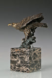 Bronze eagle sculpture ready to fly with wings partially spread and marble base. A powerful symbol of strength, freedom, and ambition.