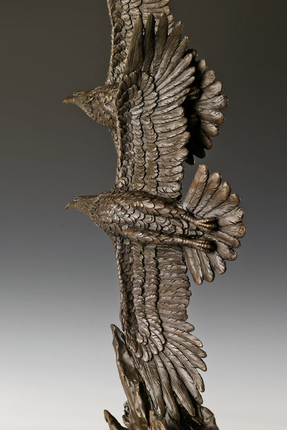 Double eagle bronze sculpture featuring two soaring eagles with wings spread. A powerful symbol of freedom, strength, and aspiration.