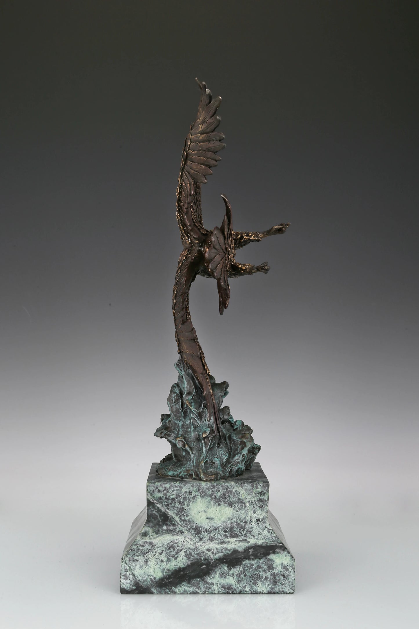 Eagle taking flight bronze sculpture with detailed feathers and marble base. Perfect wildlife statue for home decor, office, and collectors.