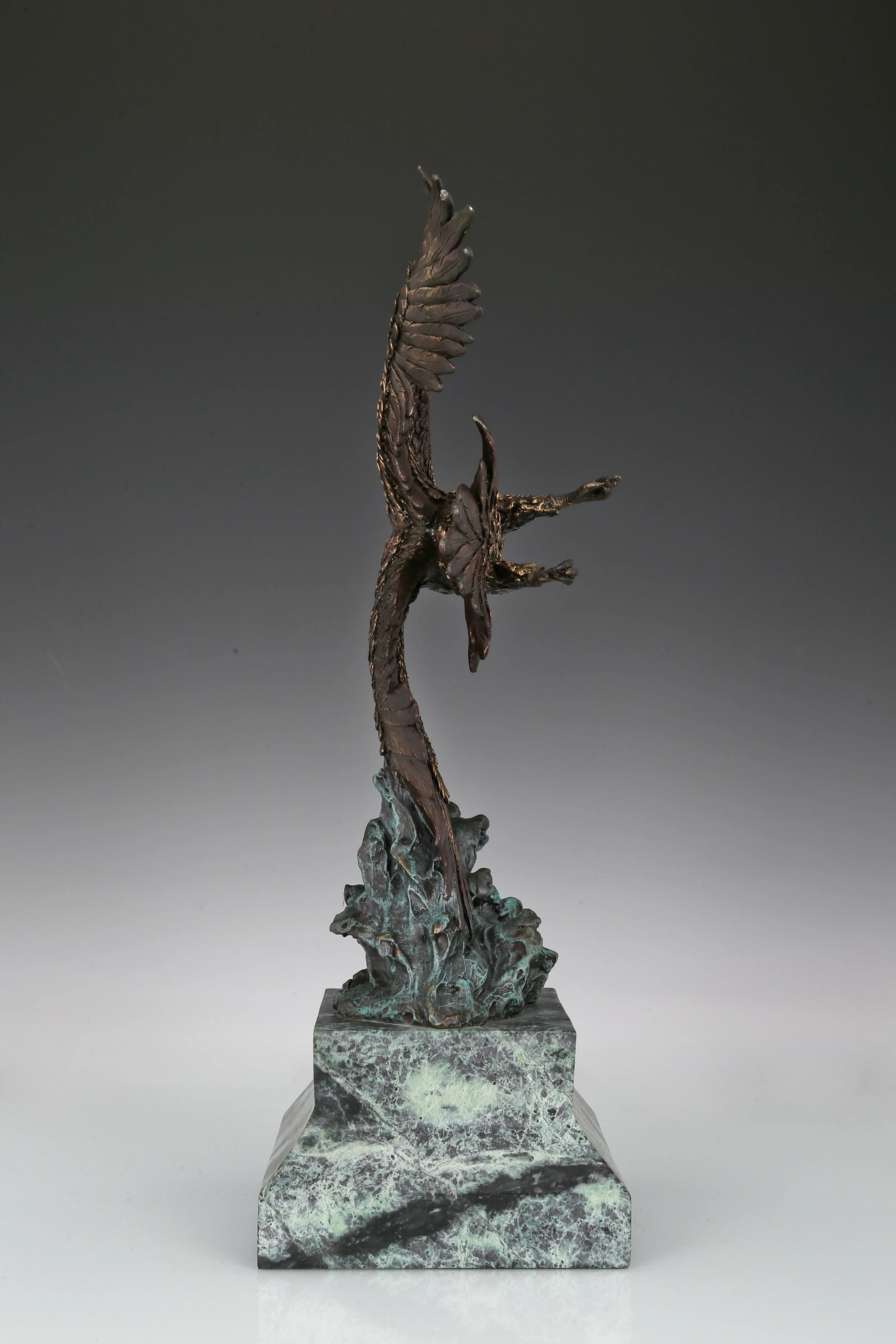 Eagle taking flight bronze sculpture with detailed feathers and marble base. Perfect wildlife statue for home decor, office, and collectors.