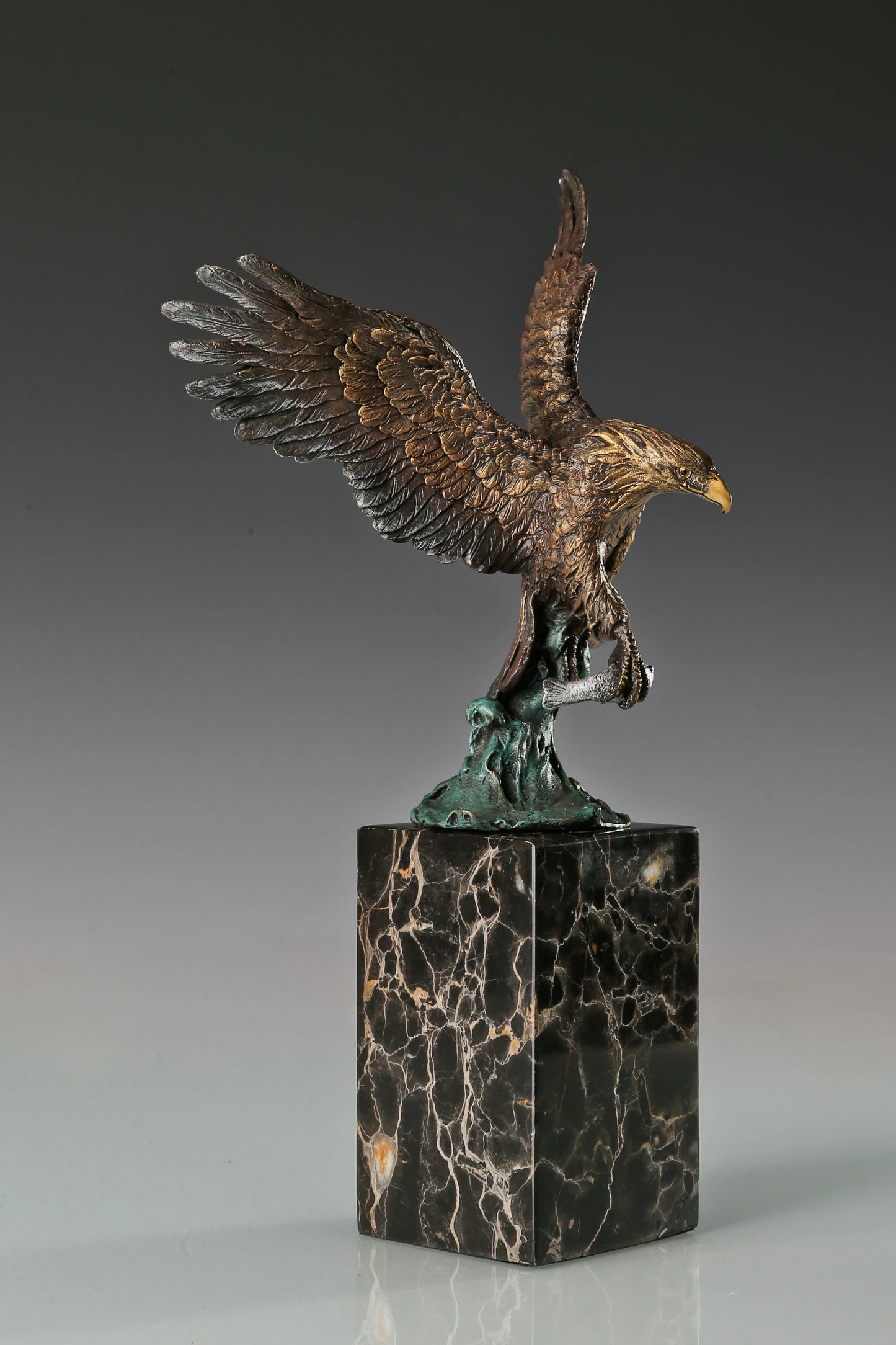 handcrafted bronze eagle sculpture featuring spread wings and detailed feathers. this striking wildlife statue symbolizes strength, freedom, and prestige.