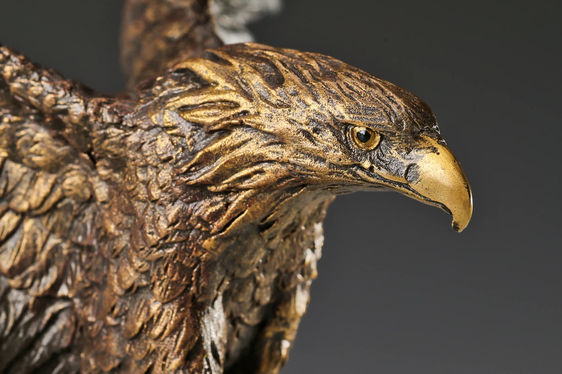 majestic bronze eagle sculpture with wings fully spread and marble base. a powerful wildlife statue symbolizing freedom, strength, and authority.
