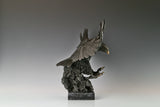 Majestic bald eagle bronze sculpture with wings spread and talons extended. A powerful wildlife statue symbolizing freedom, strength, and leadership.