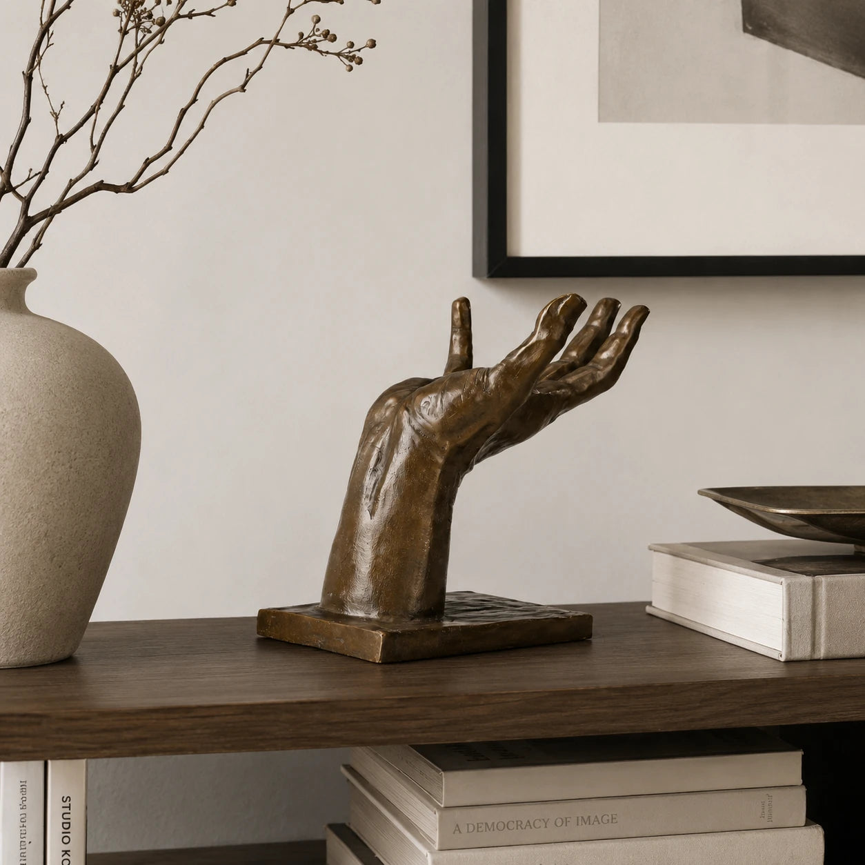 Helping Hand Surreal Bronze Sculpture displayed in a styled interior
