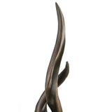 Intertwined flowing forms detail in abstract sculpture