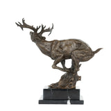 Left side view of leaping reindeer bronze statue on marble base