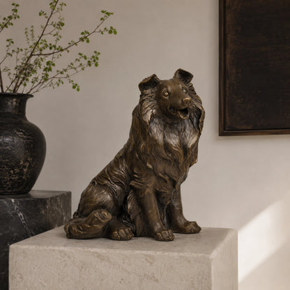 A lifelike bronze collie dog statue in a seated pose with a friendly alert expression, perfect for home living room or mantle decor.