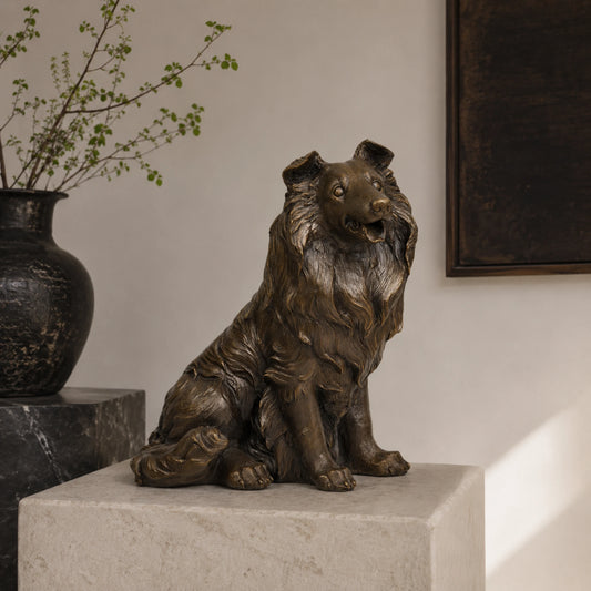 A lifelike bronze collie dog statue in a seated pose with a friendly alert expression, perfect for home living room or mantle decor.