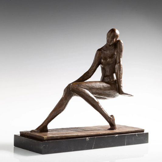 Front three-quarter view of seated bronze woman with one hand beside her face and legs extended