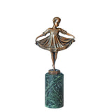 Front view of little girl ballerina bronze sculpture holding her flowing dress on a green marble pedestal