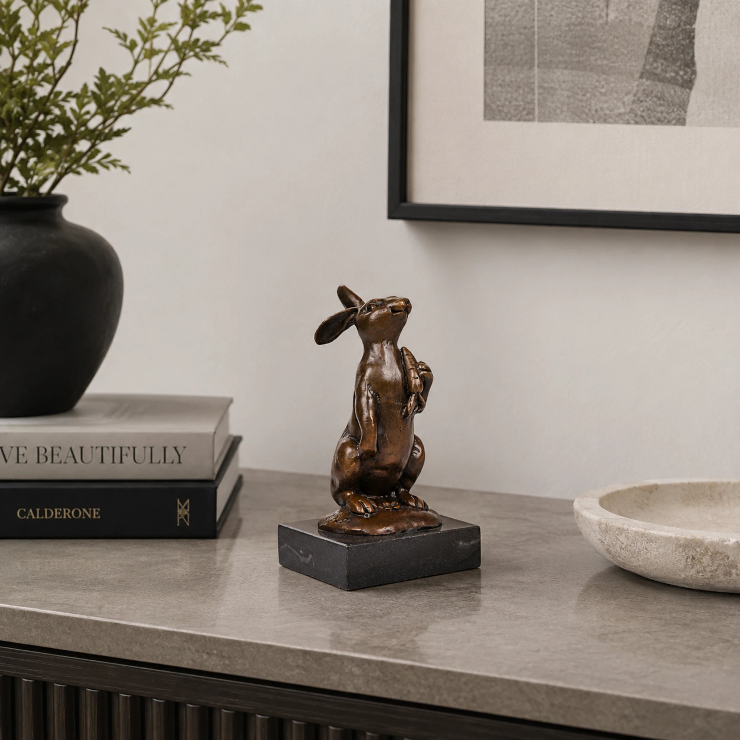 Looking-Up Rabbit Bronze Sculpture displayed in a styled interior