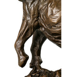 Detailed view of a lost-wax bronze elephant sculpture highlighting its wrinkled skin and the polished black marble plinth with golden veining.