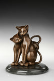 Close-up of the warm bronze patina and smooth finish on the cat sculpture