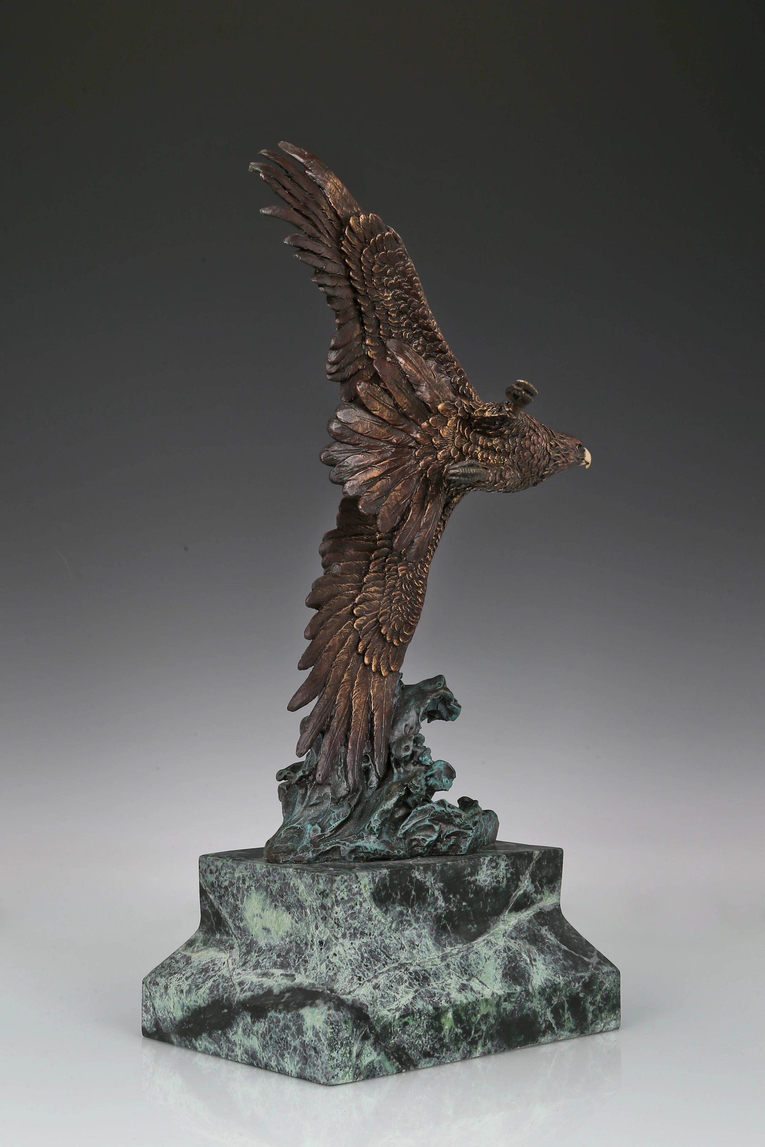 Eagle taking flight bronze sculpture with detailed feathers and marble base. Perfect wildlife statue for home decor, office, and collectors.
