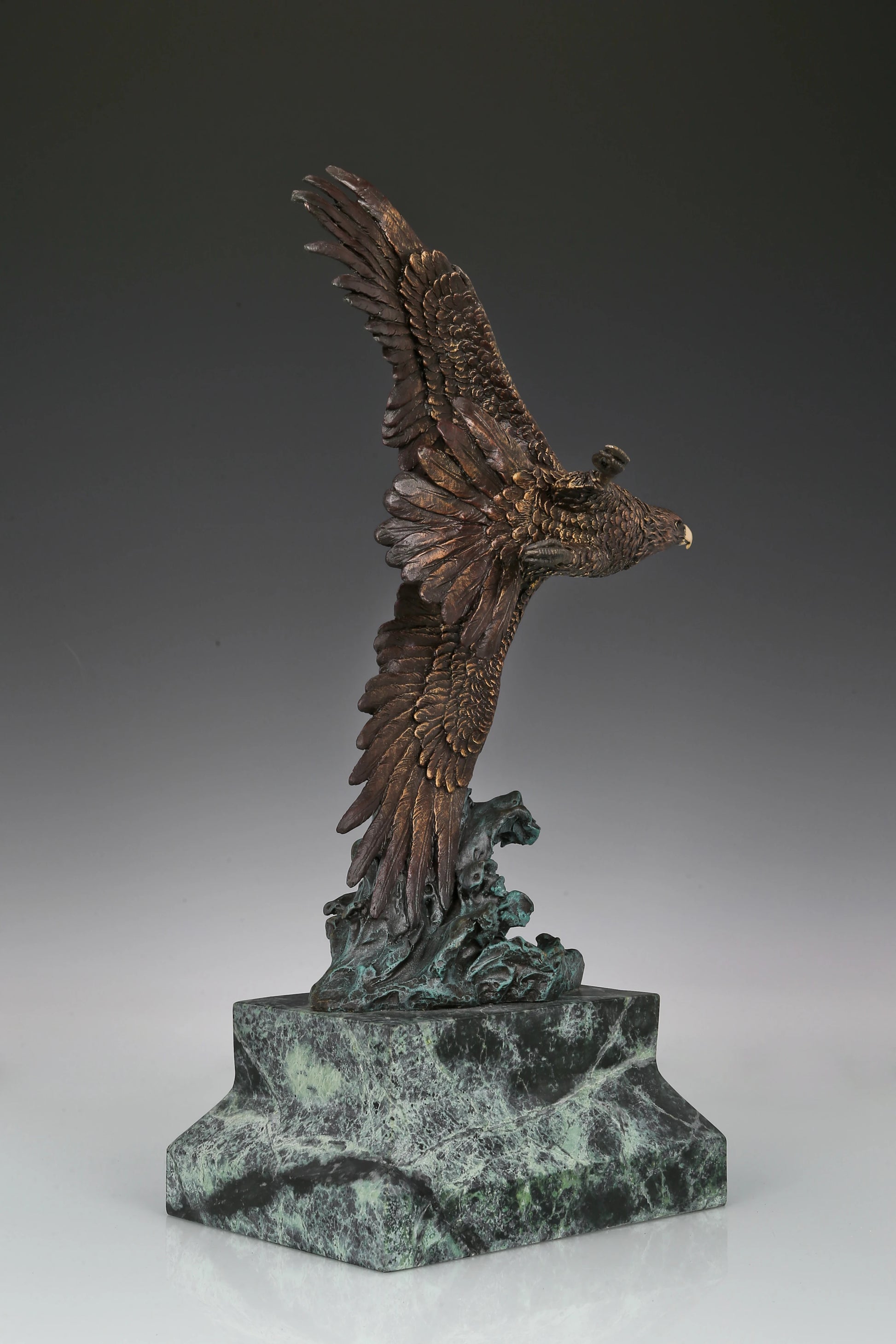 Eagle taking flight bronze sculpture with detailed feathers and marble base. Perfect wildlife statue for home decor, office, and collectors.