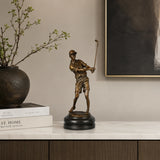 Male Golfer Bronze Sculpture displayed in a modern interior
