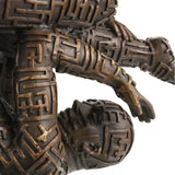 Maze pattern detail on bronze human sculpture