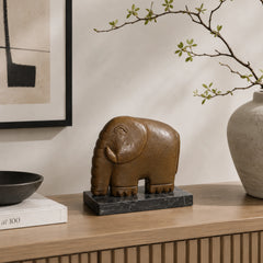 A minimalist abstract bronze elephant sculpture with geometric form and a clean silhouette, ideal for modern home mantle or entryway decor.