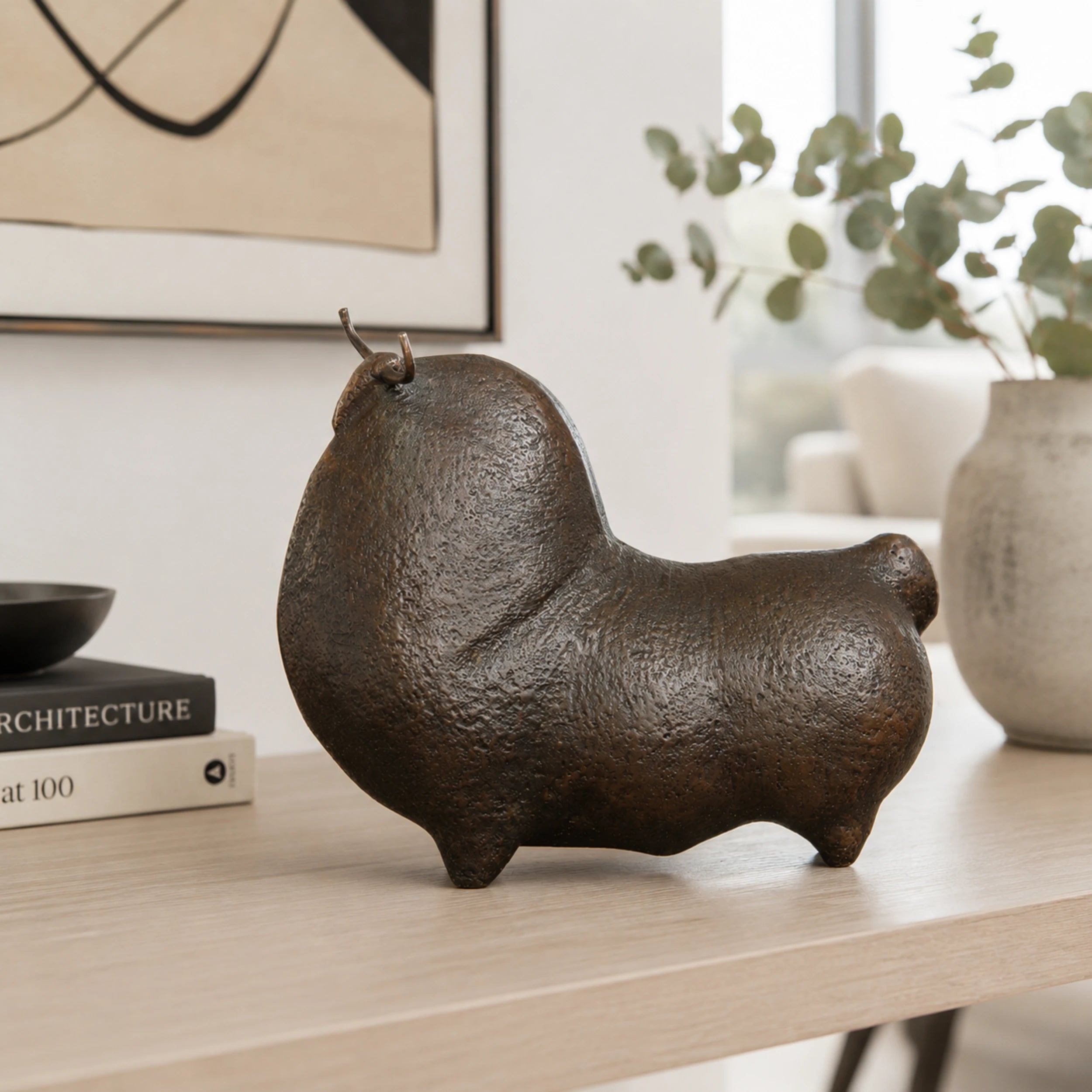 Minimalist bronze bull sculpture handcrafted using the lost-wax casting method for modern home and office decor.