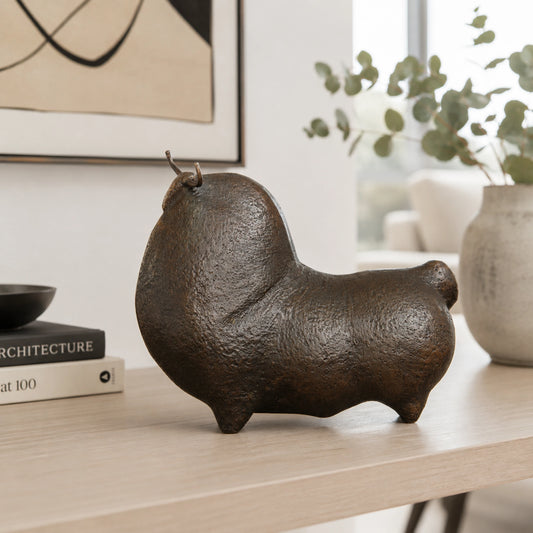 Minimalist bronze bull sculpture handcrafted using the lost-wax casting method for modern home and office decor.